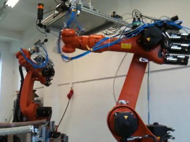 Robot assemble black ping pong balls