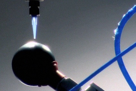 Robot assemble black ping pong balls