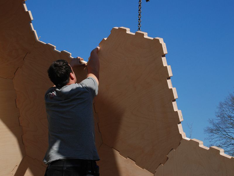 Robot building a panelized house