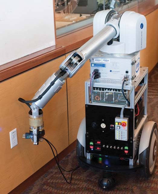 Intel Marvin Robot Plugging Itself into a Wall Outlet