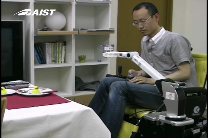 Telescoping Robot Arm mounted on Wheelchair Lifting a Cup for a Drink