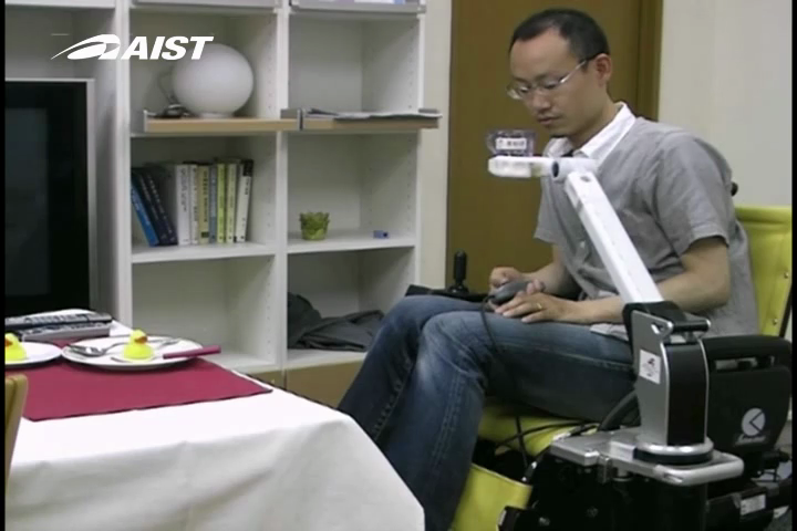 Telescoping Robot Arm mounted on Wheelchair Lifting a Cup for a Drink