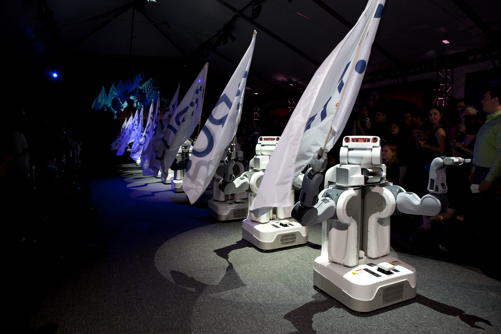 PR2 Robots performing coordinated flag-waving dance